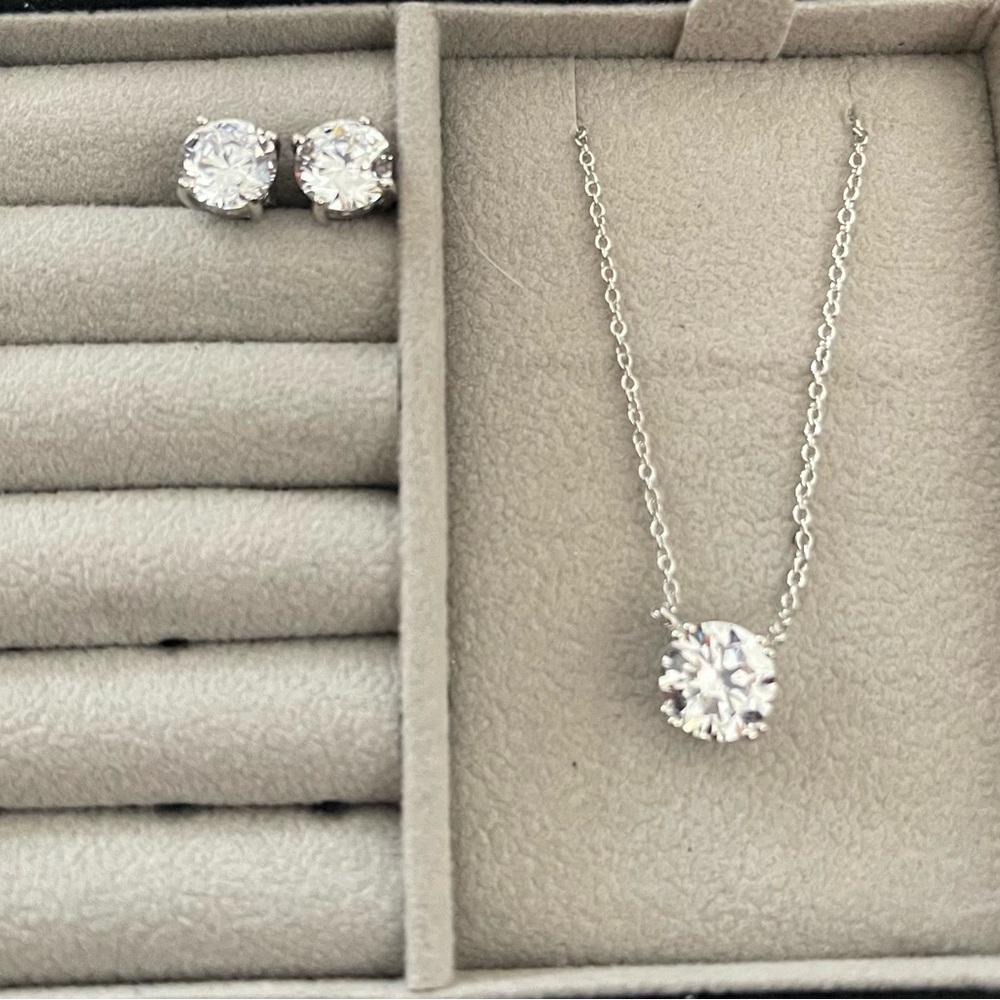 Brand new cubic zirconia necklace and earrings. They have never been worn!